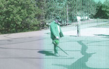 Using a leafblower to prepare the driveway for Asphalt Sealcoating